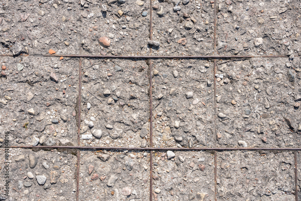 Fototapeta premium aged concrete wall with rebar showing through texture