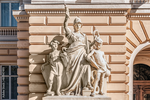 Lviv, Ukraine - November 2, 2023: Allegorical sculptural composition of the Science and Wisdom, or Education by Teodor Rygier in front of the entrance to the Ivan Franko National University of Lviv