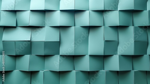  A tight shot of a mosaic wall, composed of various-sized, light green cubes