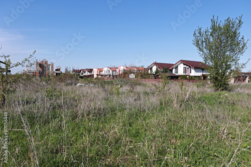 Field with dry grass. Uncultivated land.