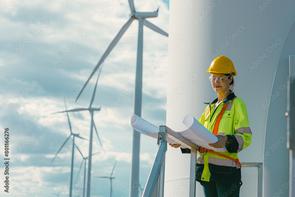 female engineer working outdoor with safety at wind turbines clean energy power station background, worker people with renewable energy technology for future concept. female engineer working outdoor with safety at wind turbines clean energy power station background, worker people with renewable energy technology for future concept.