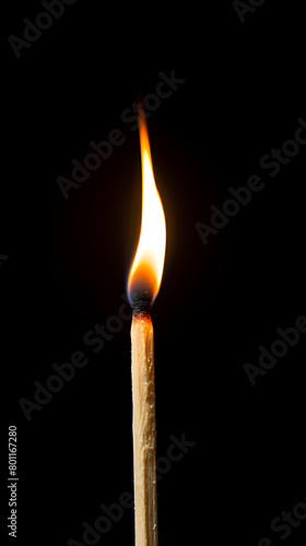 Close up of burning match isolated on black background