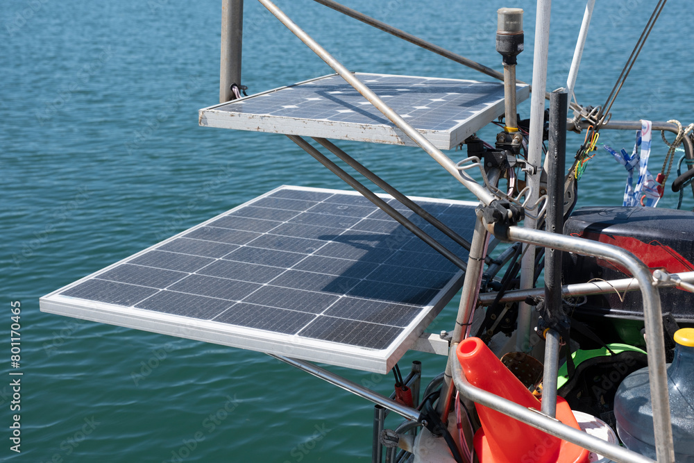 Solar panels on the stern of a sailboat. This means that the ship is always provided with free electricity and independent of shore power. Sustainable energy