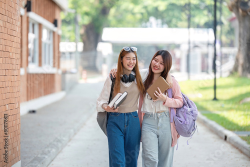 University student girl friends with learning book college while walking in campus