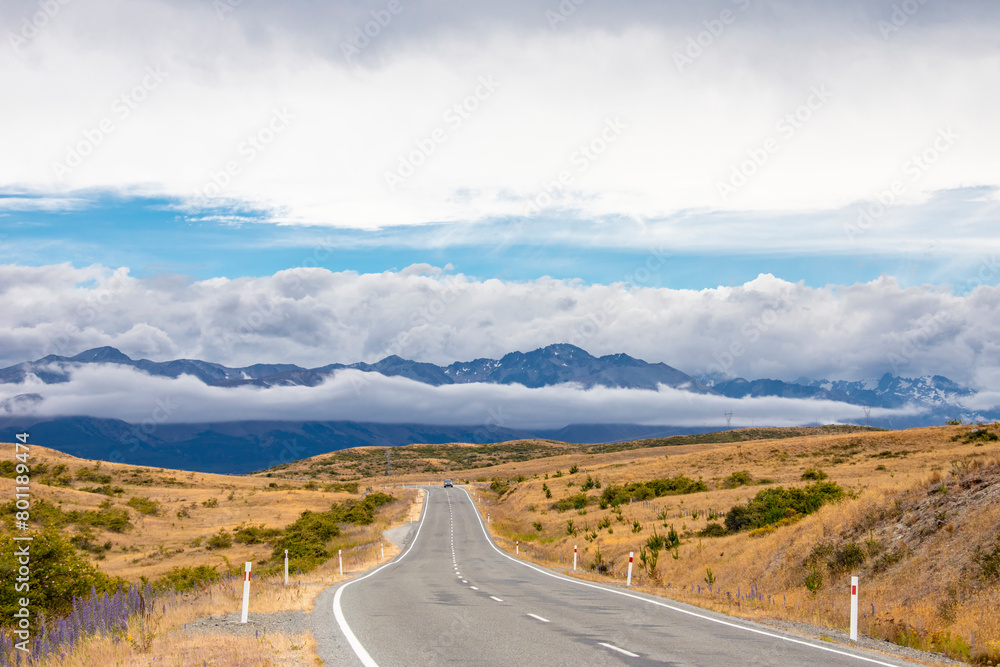 the highway in south island new zealand. the backgroud is southern alps mountains. 