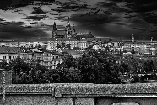 Creative view of the beautiful Prague Castle across the river. Night atmosphere dominant castle, monochrome postcard, background.