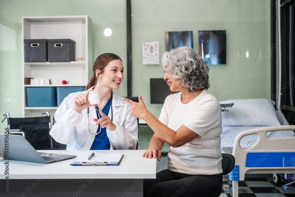 Monthly health check-ups and counseling sessions are provided to an elderly Asian woman by a Caucasian female caregiver, offering support, advice, and motivation. Monthly health check-ups and counseling sessions are provided to an elderly Asian woman by a Caucasian female caregiver, offering support, advice, and motivation.