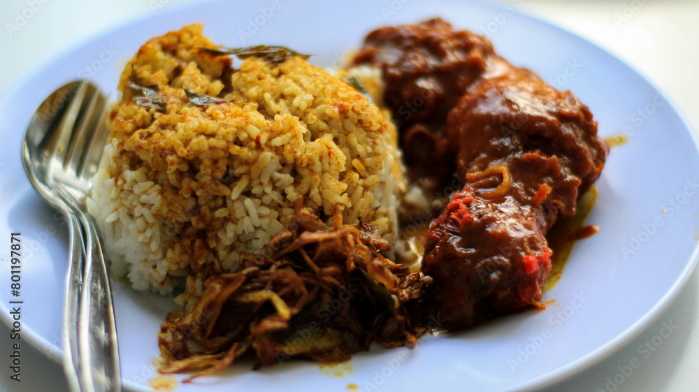 Nasi Kandar with red fried chicken as a side dish Nasi Kandar with red fried chicken as a side dish