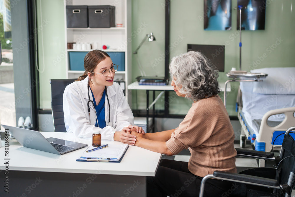 Obraz premium Caucasian female psychiatrist sits at her desk, providing mental health consultations and therapy sessions to her patients with empathy and expertise. elderly patient sit on wheelchair.