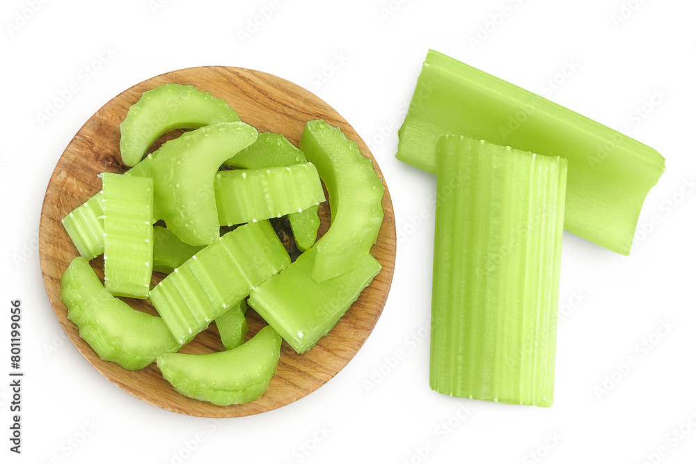 Obraz premium fresh celery in wooden bowl isolated on white background. Top view. Flat lay