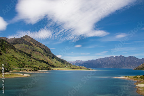 the view of lake Hawea.  It is in the Otago Region New Zealand,  at an altitude of 348 metres. It covers 141 km² and reaches 392 metres deep.