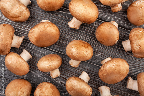 brown mushroom pattern on wood background top view © bergamont