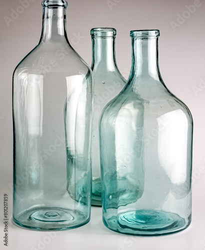 Empty old glass jars with a narrow neck for wine and spirits. Made in the USSR around 1930s