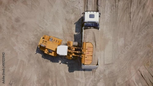 The work of loading equipment in the sand quarry