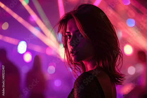 portrait of a beautiful woman in neon rays in a nightclub. woman relaxing and having fun