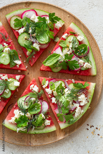 watermelon pizza salad with feta cheese, cucumber and radish