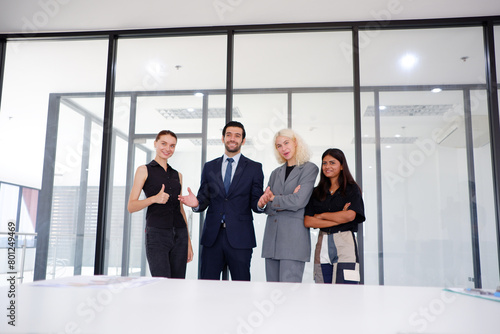 Businessman and businesswoman standing and smiling.