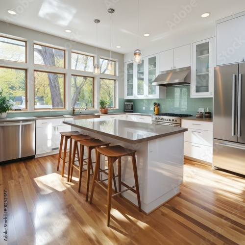 Modern kitchen with large windows and a wood dining table with four chairs © duyina1990
