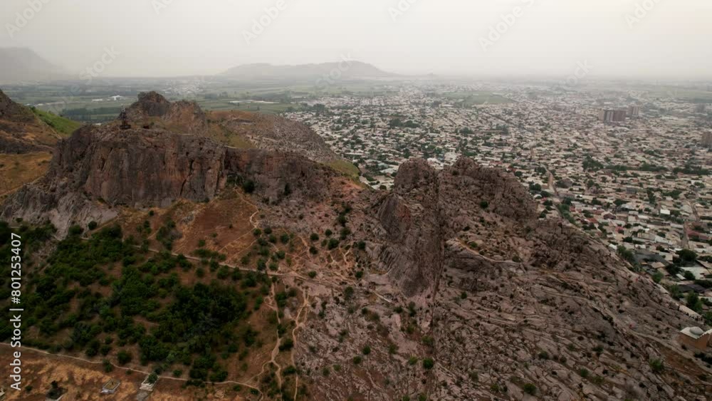 Aerial view of Osh city, Sacred Mountain Sulaiman Too in city centre. Beautiful powerful mountain. Aerial view of Osh city, Sacred Mountain Sulaiman Too in city centre. Beautiful powerful mountain.