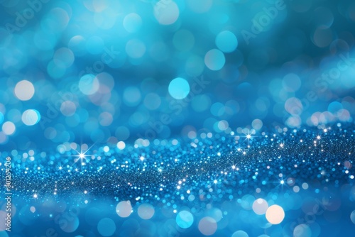 Blue glitter sparkles on a blue background photo