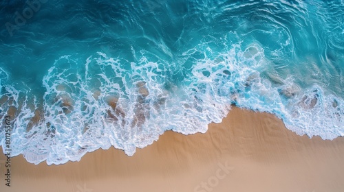Serene seaside scene capturing the gentle caress of ocean waves on a sandy beach at golden hour