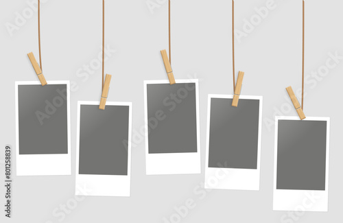 vertical polaroids hanging from string