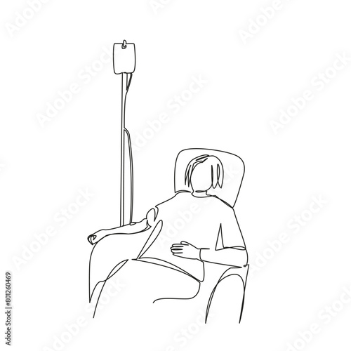 girl sitting with a chemotherapy drip