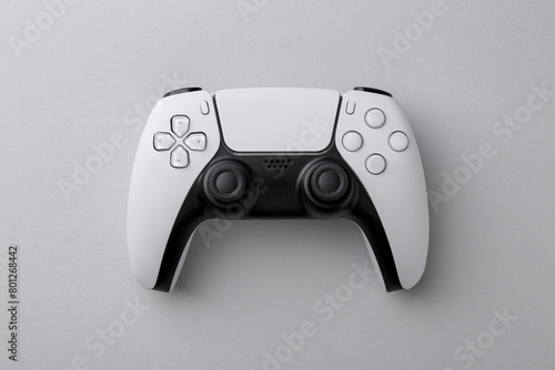 Wireless game controller on light grey background, top view