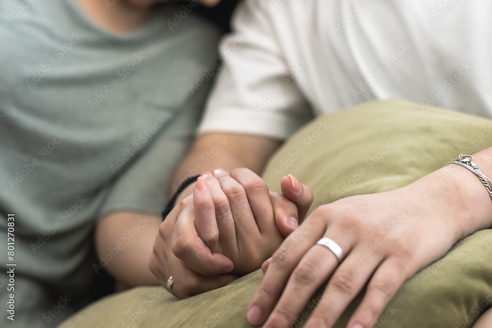 close up of hands holding each other, love and encouragement concept close up of hands holding each other, love and encouragement concept
