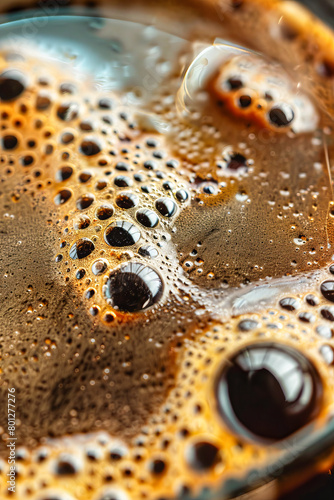 Close up of a cup of coffee with bubbles. Macro shot.