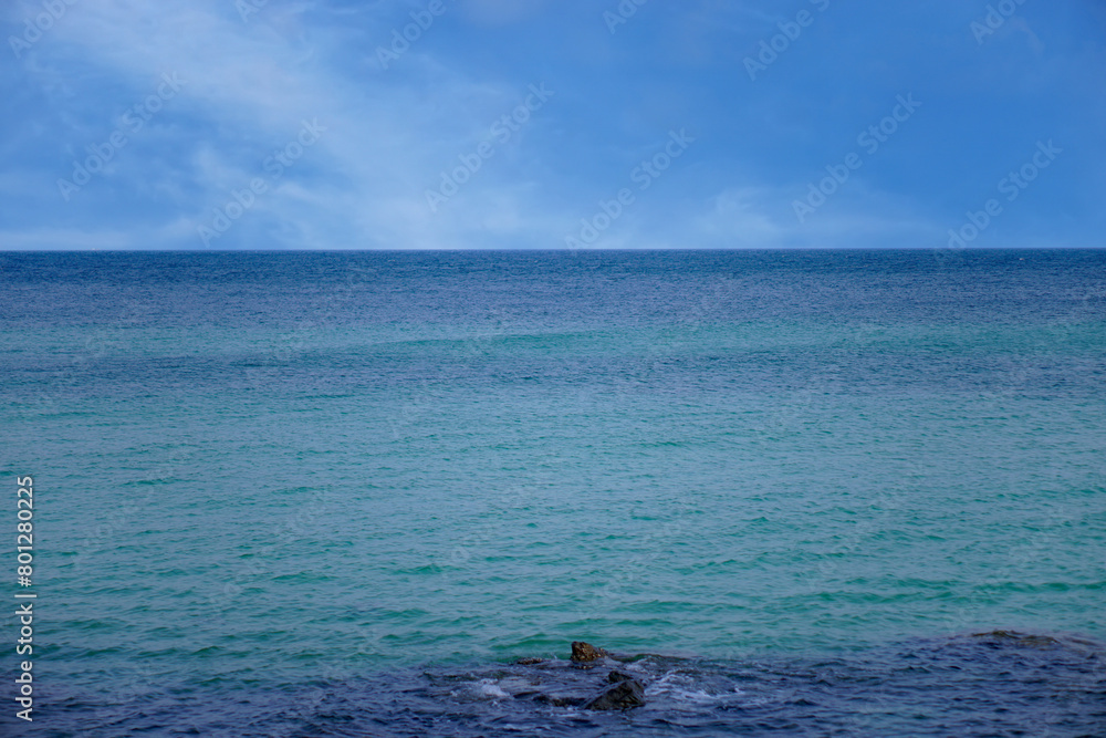 The blue sea and empty sky had nothing visible just on the horizon.