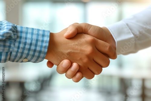 Business handshake agreement between two multiethnic people