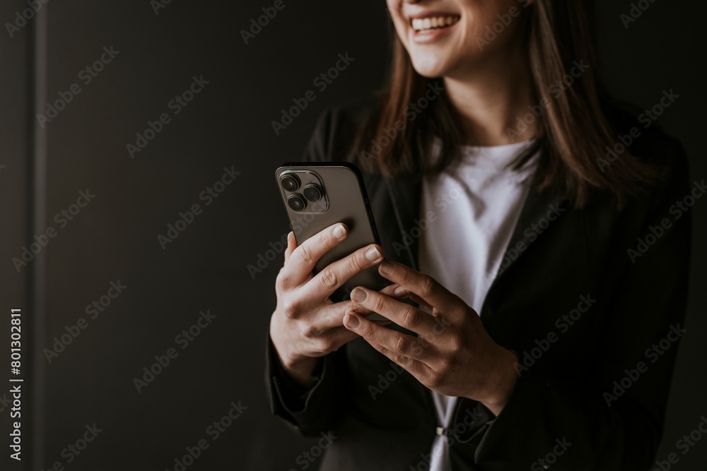 Businesswoman texting on her phone Businesswoman texting on her phone