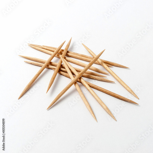Group of double-tip wooden sticks on white background photo