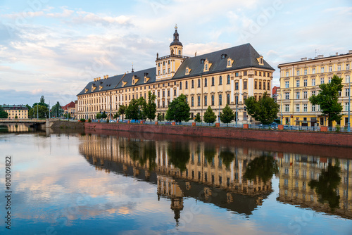On a peaceful and lightly cloudy summer evening like this the old (1702) University of Wrocław, Poland, reflects beautifully in the Oder River.