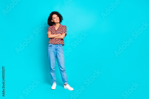 Photo of attractive girl crossing hands look empty space isolated cyan color background