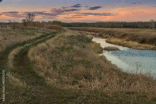 Spring evening over an irrigation canal at Wapisu Marsh near Dundurn  Saskatchewan  Canada.
