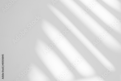 Gray shadow and light blur abstract background on white wall  from window. Dark stripe grey shadows indoor in room  background, monochrome, shadow overlay effect for backdrop and mockup design