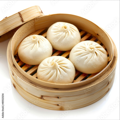 Chinese Steamed buns in a bamboo steamer on a white isolated background, copy space.  Asian xiaolongbao cuisine and cooking concept.