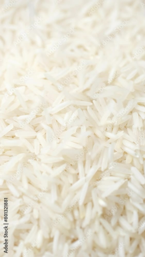 Raw rice basmati falling down on heap Raw rice basmati falling down on heap