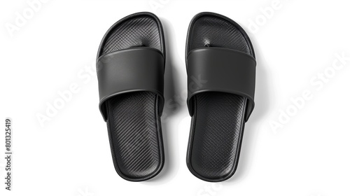 Isolated black sandals with slip-ons against a white backdrop. A blank, label-free mockup of your logo design. A simple pair of slide sandals with an open toe for ladies, men, and kids. Top view. 