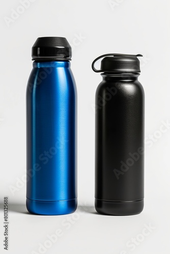 Isolated blue and black thermo water bottles against a white background