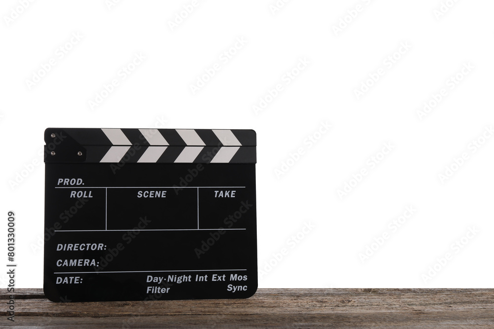 Naklejka premium Movie clapper on wooden table against white background, space for text