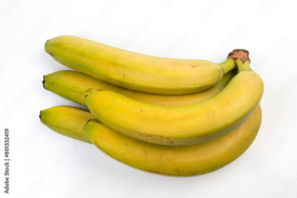 Bunch of unripe, green bananas isolated on white background.