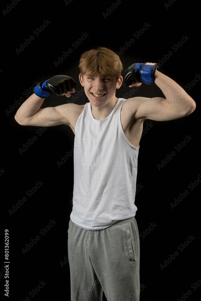 A Teenage Male Boxer and Black Background A Teenage Male Boxer and Black Background