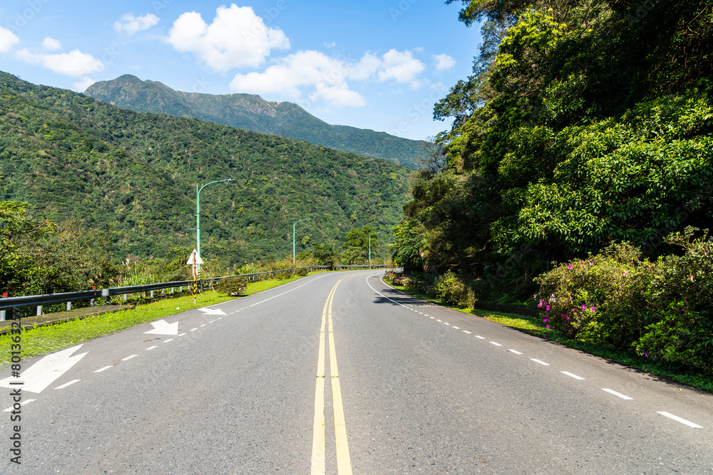 View of Yangjin Highway in Yangmingshan National Park, New Taipei City, Taiwan. There are beautiful natural landscapes along the road. View of Yangjin Highway in Yangmingshan National Park, New Taipei City, Taiwan. There are beautiful natural landscapes along the road.