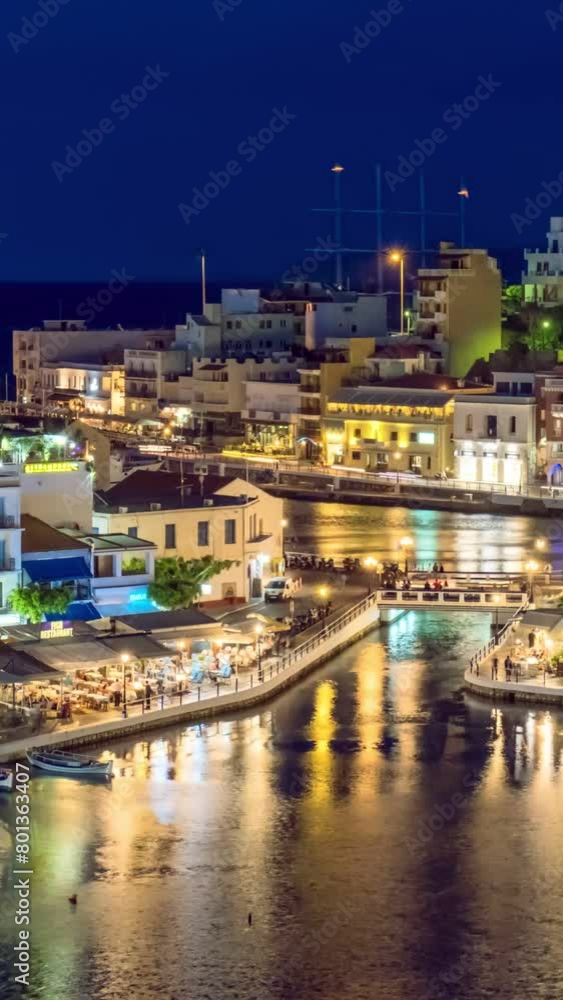 Timelapse of the lake Voulismeni and Agios Nikolaos town at night. Lasithi region of Crete island, Greece Timelapse of the lake Voulismeni and Agios Nikolaos town at night. Lasithi region of Crete island, Greece