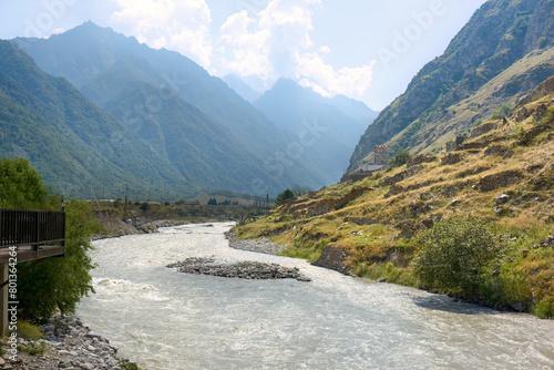 A beautiful mountain river near the village of Upper Balkaria. Mountain river against the backdrop of the Caucasus mountains.