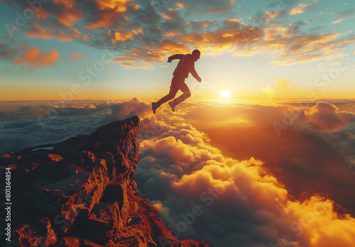 Silhouette of man jumping from cliff with beautiful landscape background, concept of freedom and challenge or business development. Silhouette of man jumping from cliff with mountain and river  © Sweetrose official 