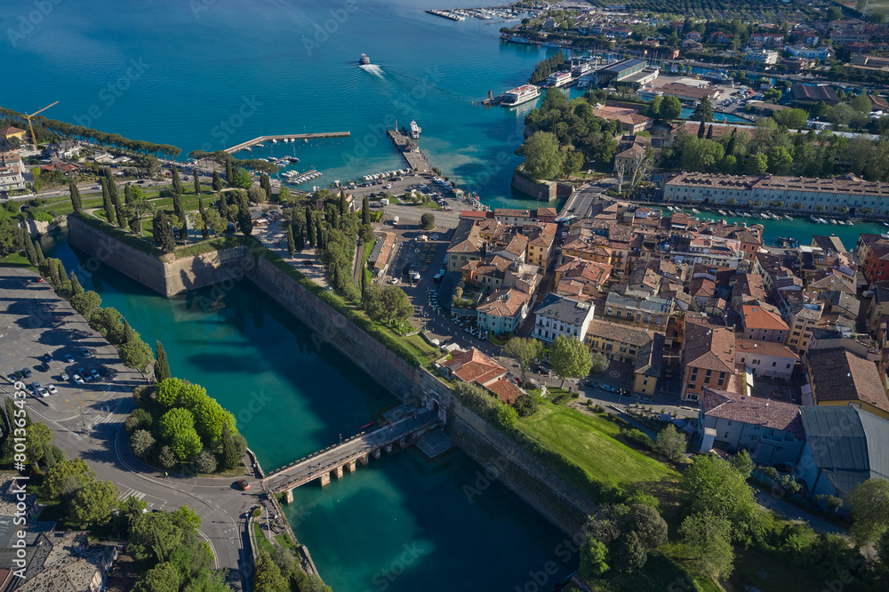 Top view of the town of Peschiera del Garda, the main gate of Porta Brescia located on the shores of Lake Garda. The largest lake in Italy. Resorts on Lake Garda Italy. City on the water Italy.